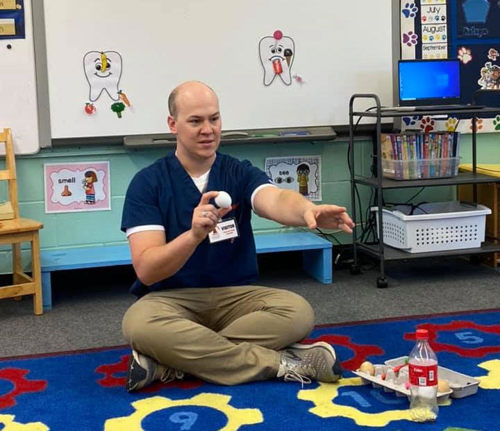 Photo of Dr. Smallidge in kindergarten classroom