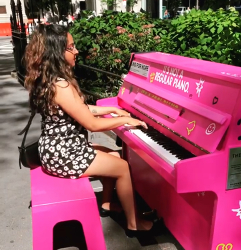 Photo of Dr. Kulkarni playing piano