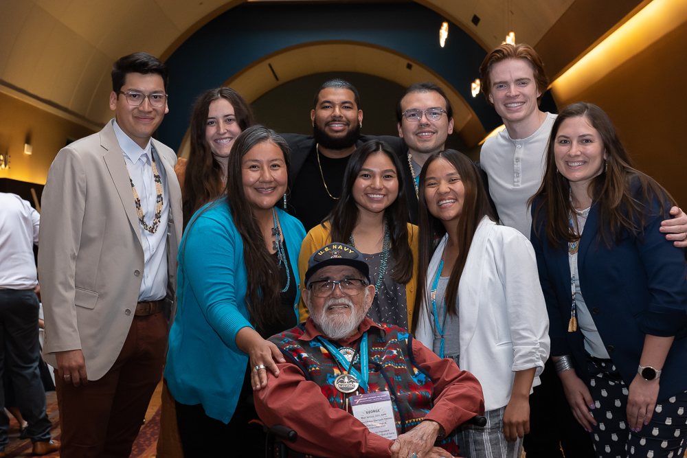 Attendees at the 2022 Society of American Indian Dentists surround Dr. George Blue Spruce.