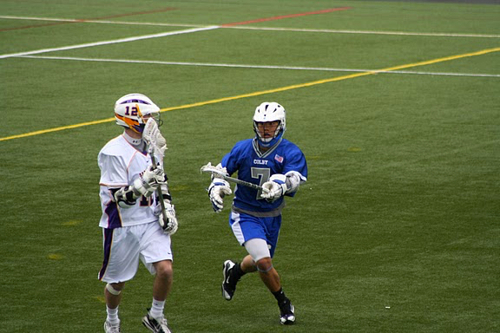 Photo of Dr. Lee playing lacrosse