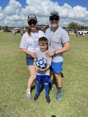 Photo of Dr. Smallidge with wife and son at soccer game