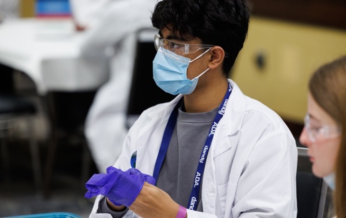 Photo of high schoolers participating in modules at symposium