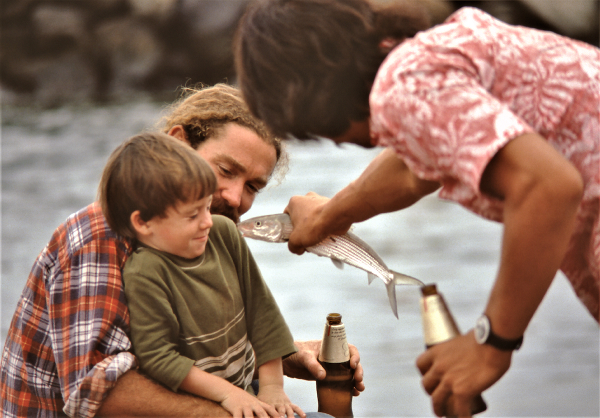 Photo of family at fishing port in Italy