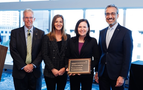 Photo of ADA President-elect Thomas Paumier, D.D.S. (from left); Bre Kenworthy from Colgate; Julie Frantsve-Hawley, Ph.D., recipient of the Evidence-Based Dentistry Mid-Career Faculty Award; and ADA Executive Director Nader Nadershahi, D.D.S., M.B.A., Ed.D.
