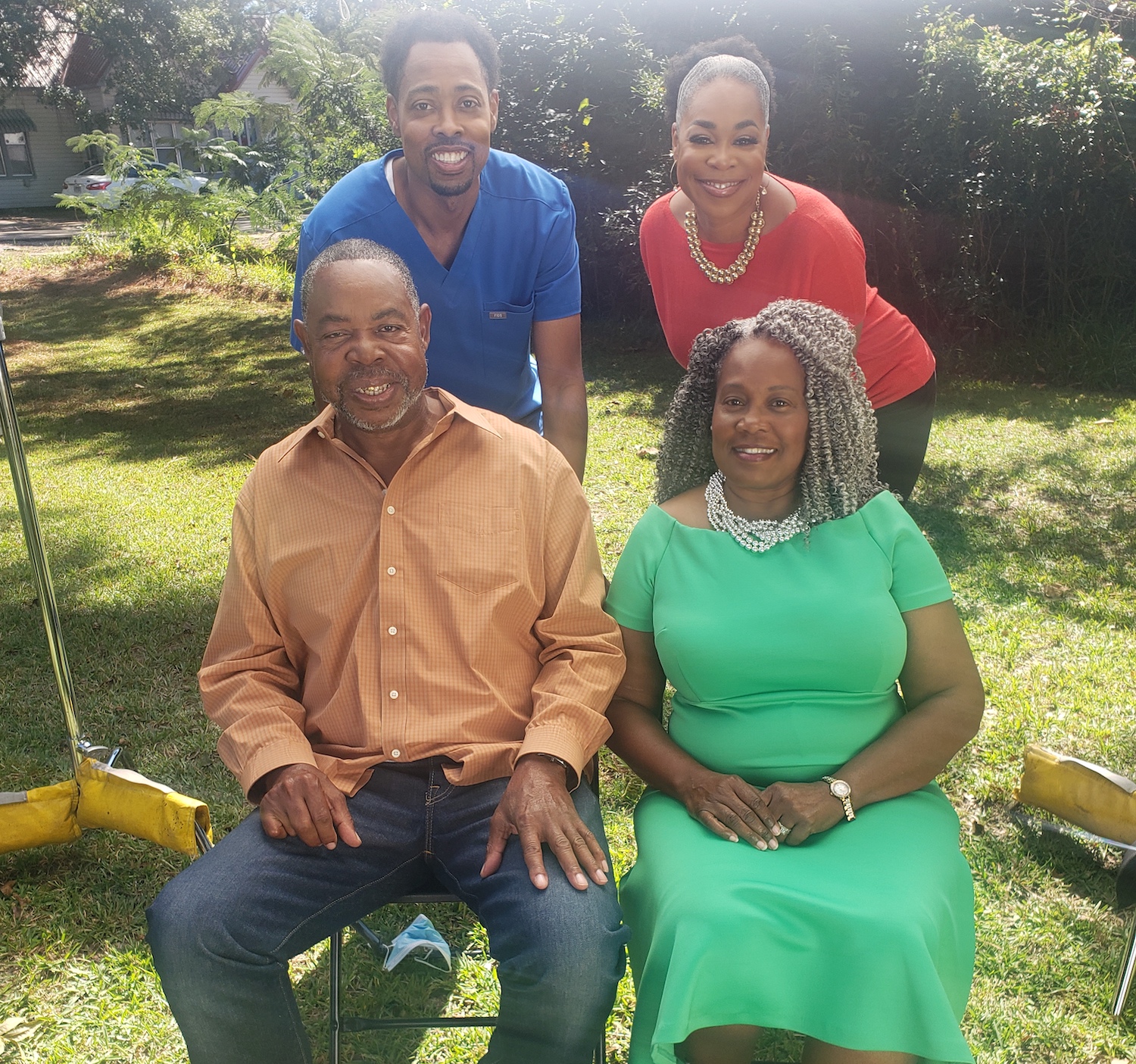 Dr. Giles Willis Jr. enjoys a family moment with his sister, Lecia, and his parents in Lewisville, Arkansas.
